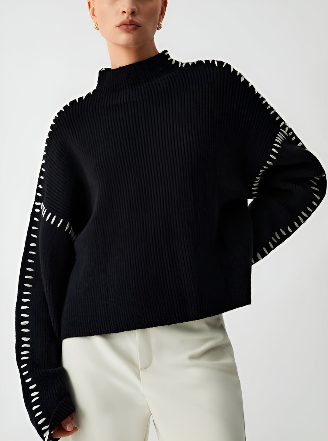 Knitted jumper with stitched details